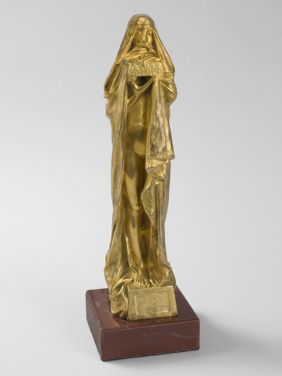 A French Art Nouveau gilt-bronze sculpture by Pierre Fix-Masseau, depicting a woman with a woman, eyes closed, finger over lips holding a mysterious box. Titled “Le Secret.” Circa 1900.

Pictured in:  Art Nouveau Sculpture  by Alastair Duncan,