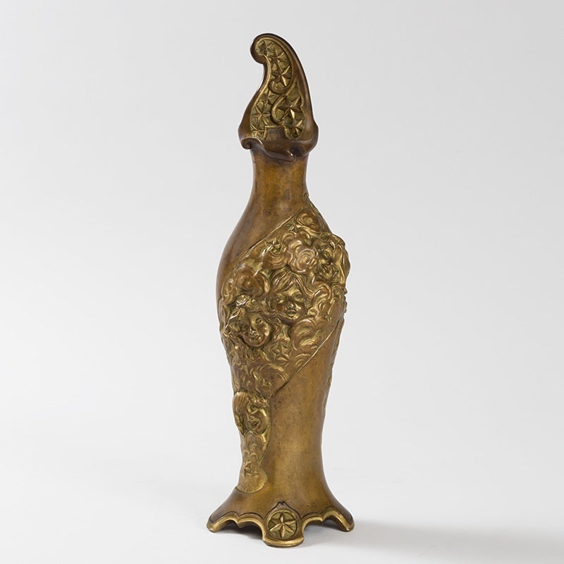 A French Art Nouveau patinated bronze vase by Charles Korschann. The vase features an ascending spiraling band decorated with cloud-like swirls, women’s faces, pansy blossoms and stars. Circa 1900.

Signed, 