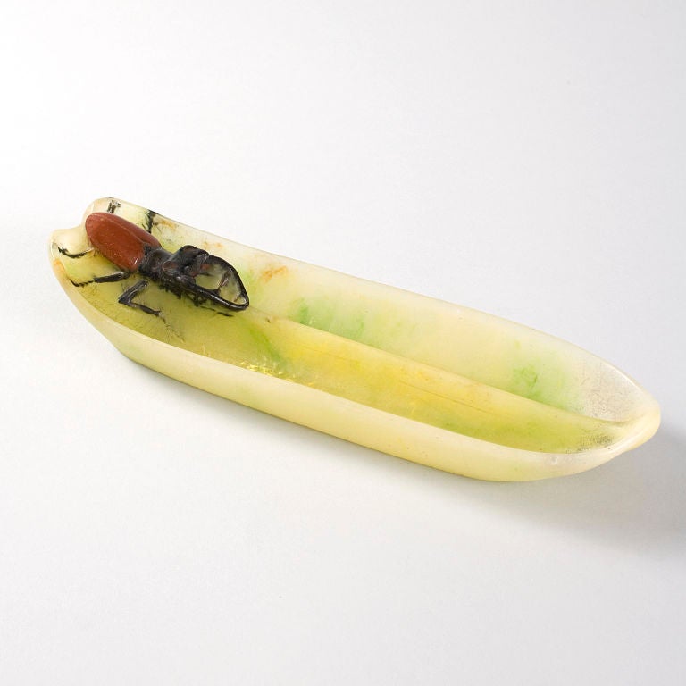 A French pate-de-verre pentray by Amalric Walter. The pen tray is from l’Ecole de Nancy and features a horned beetle crawling along a leaf. The study of botany and entomology was in fashion within artistic circles, circa 1900 and the detailed