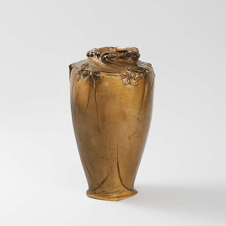 A French Art Nouveau gilt bronze patinated vase ornamented with five arabesques and abstract curvilinear decoration by Hector Guimard. Only one other example of this model of vase is known, signed and dated 1908 and now in a private collection. It