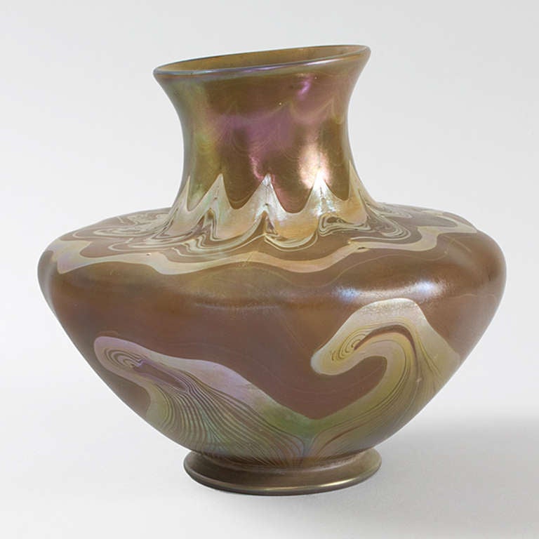 A Tiffany Studios New York Favrile glass vase with iridescent pulled decoration in the style of a Hopi vase. Louis Comfort Tiffany had more than five hundred Native American objects, including baskets, implements, and articles of clothing from the