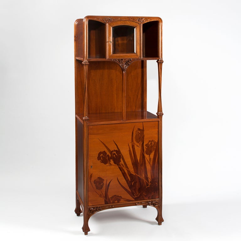 A French Art Nouveau marquetry cabinet by Louis Majorelle with depictions of iris flowers on the front panel. 

(MG #1526)

  