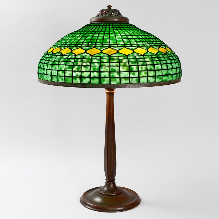 A Tiffany Studios New York patinated bronze and leaded glass 