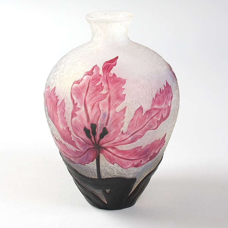 A French Art Nouveau wheel-carved and acid-etched cameo glass vase by Daum, featuring a carved mottled pink flower against an opaque textured ground. Circa 1910.

Signed, “Daum Nancy” with the Croix de Lorraine. 

(MG #10415)
