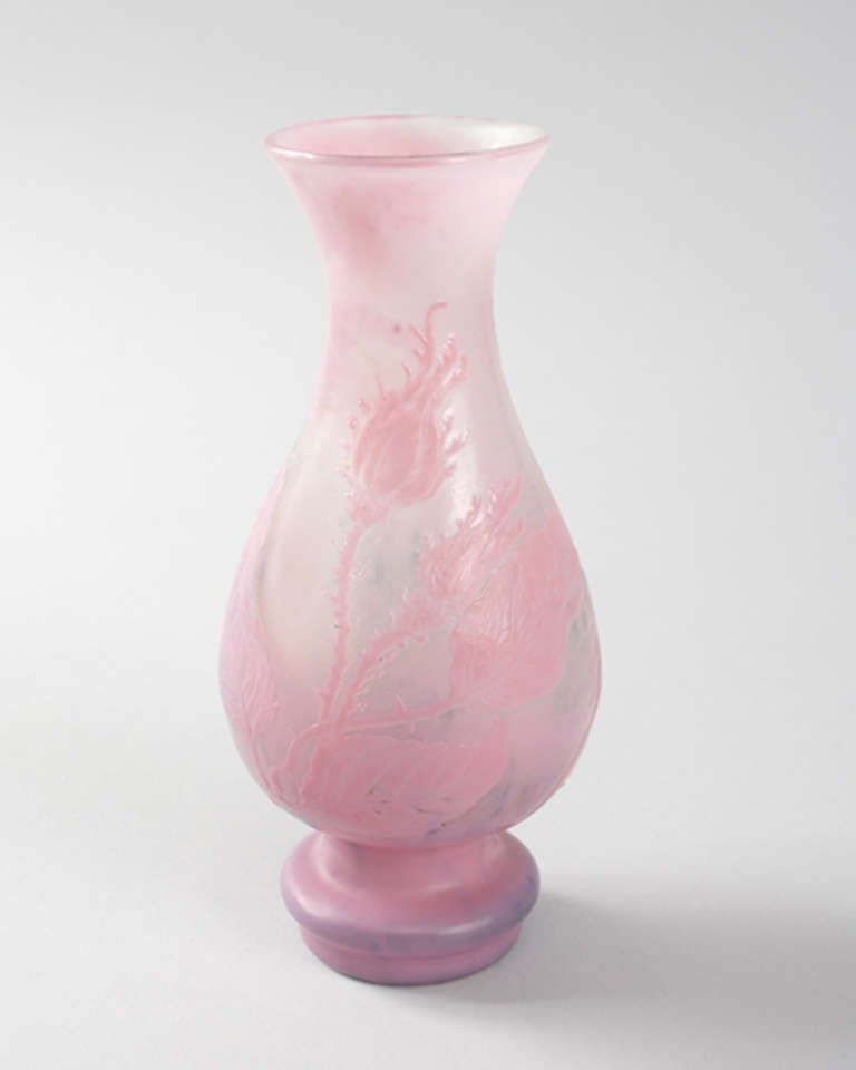 A French Art Nouveau wheel-carved cameo glass vase by Emile Gallé, featuring a pink foliate design on a white ground. Circa 1900.

Signed, “Gallé”. 

(MG #11161)