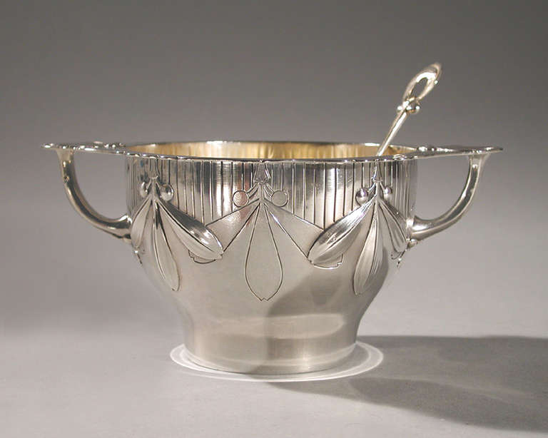 A French Art Nouveau silver bowl by Antoine Cardeilhac, featuring a mistletoe motif, with matching spoon. Circa 1900.

Signed, 