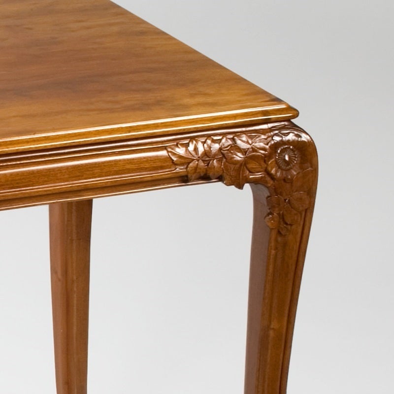 A French Art Nouveau table by Léon Jallot, featuring ornately carved flowers and leaves on the corners.  Circa 1900.   A similar table is pictured in: The Paris Salons 1895-1915, Vol. III: Furniture, by Alastair Duncan, Woodbridge, Suffolk: Antique