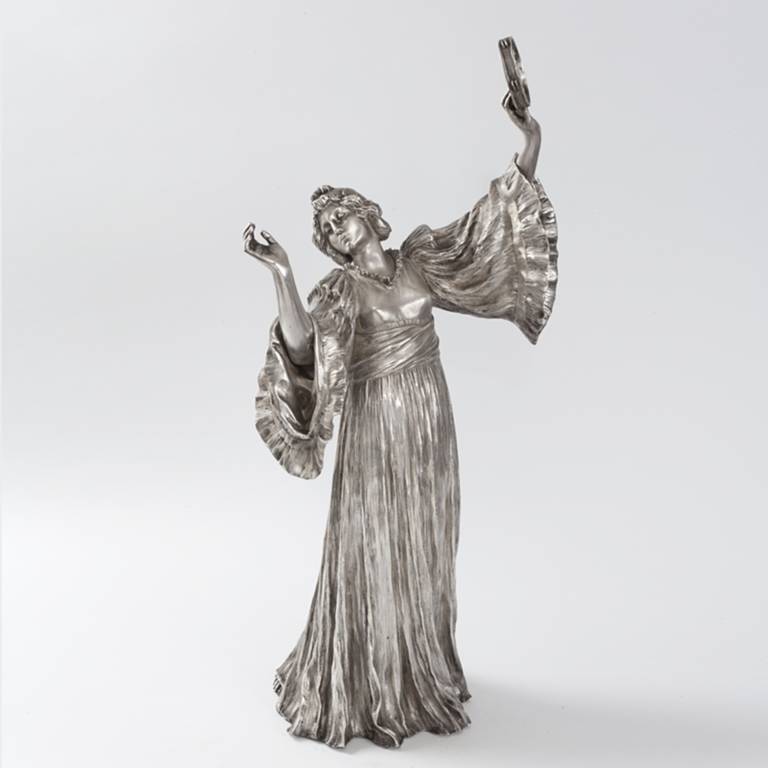 This silvered bronze figural sculpture, 