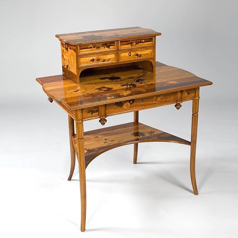 A French Art Nouveau desk by Emile Gallé, featuring a fruitwood marquetry writing surface, circa 1895.
A similar table is pictured in: Gallé Furniture by Alastair Duncan and Georges de Bartha, Woodbridge, Suffolk: Antique Collectors' Club, 2012,