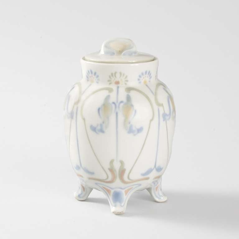 A French Art Nouveau covered porcelain jar designed by Georges De Feure and manufactured by Dufraisseix & Abbot, Limoges, for Art Nouveau Bing. In the manner of de Feure’s renowned textiles, this piece is decorated with elegantly painted abstract