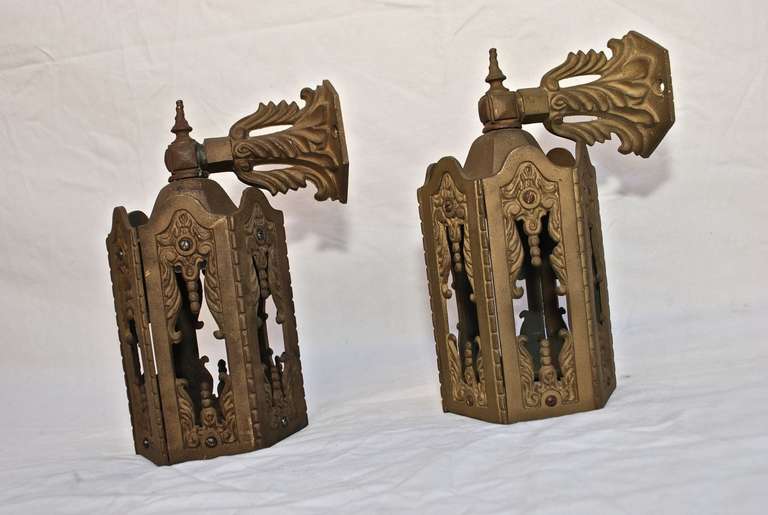 A very nice and elegant pair of 1920 cast iron outdoor sconces, in the back of one sconce they is missing a small piece of metal, rarely noticeable, you really have to look for it, plus it is in the back

ALL SALES ARE FINAL, STORE CREDIT OR