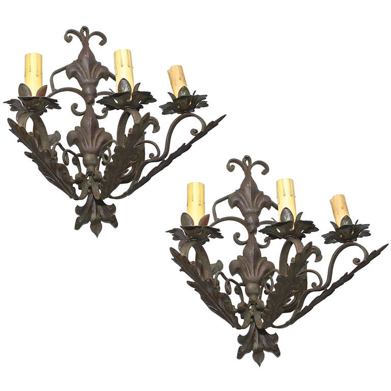 Rare set of fourteen  large French wrought iron sconces