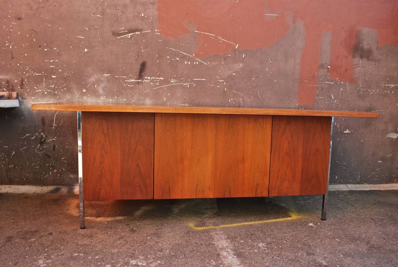 A beautiful walnut desk, it is a  heavy desk and the qualities is there, the patina is so much nicer in person, design by Floence Knoll