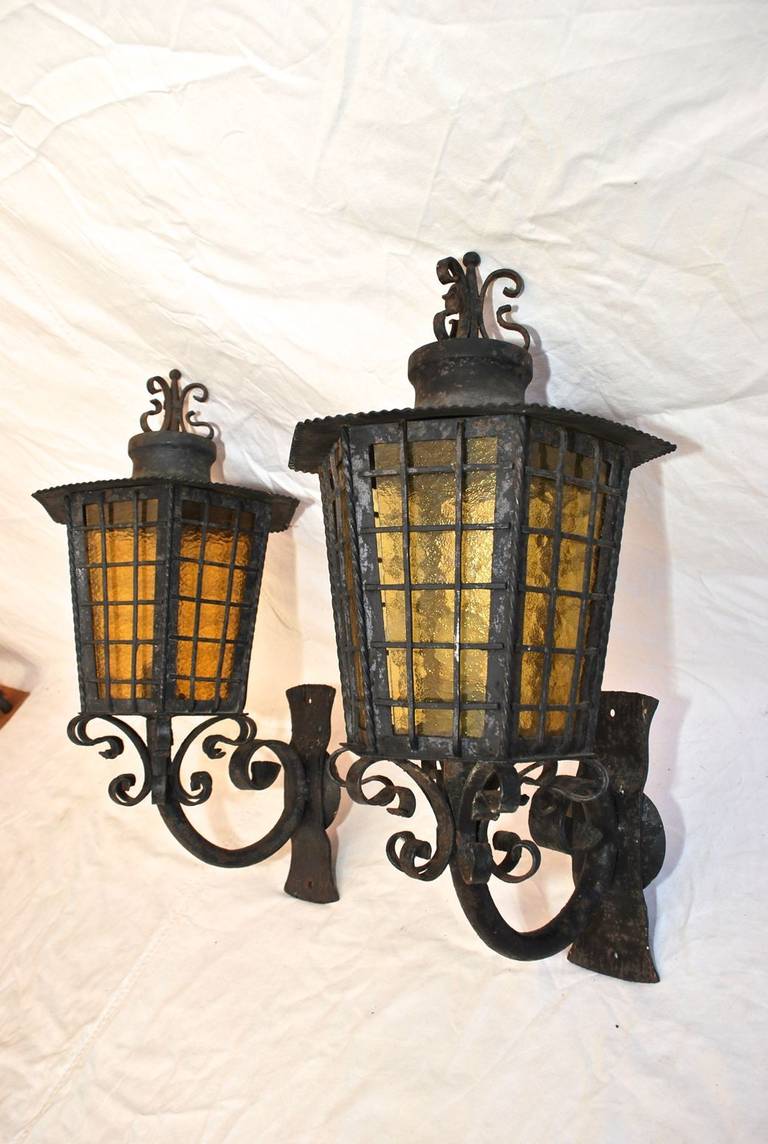 A very nice and hard to find outdoor wrought iron sconces, the picture speak for itself.
We have over three thousand antique sconces and over one thousand antique lights, if you need a specific pair of sconces or lights, use the contact dealer