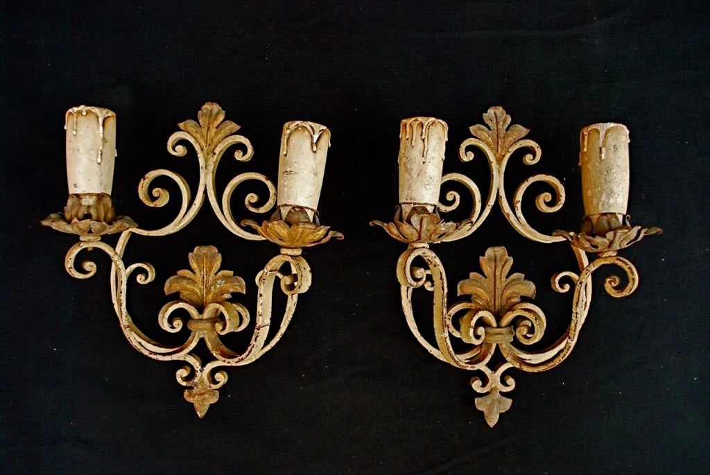 A very nice pair of French wrought iron sconces, we could make them darker if you like, the patina is much nicer in person, we  also rewire the sconces  and we put a back plate to cover the Jbox if you like
ALL SALES ARE FINAL, STORE CREDIT OR