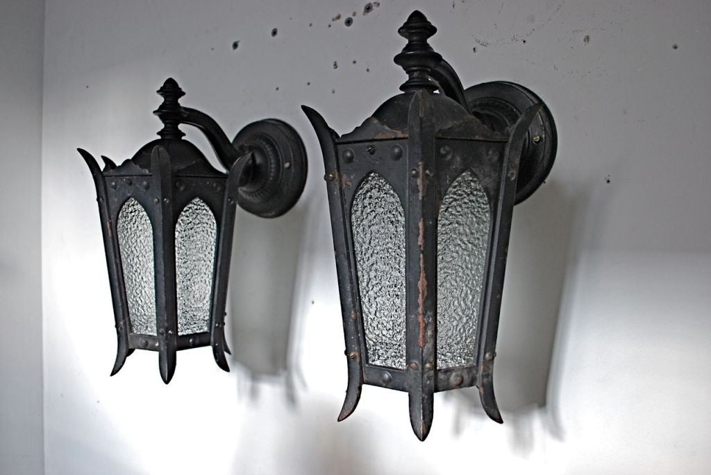 A very nice pair of outdoor sconces made of solid cast iron, it is harder to find outdoor sconces