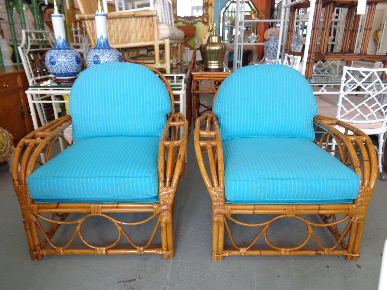 Pair of Stick Wicker Rattan CLUB Chairs in good as found VINTAGE condition. There are minor scuffs, scrapes and chips to the as found restored finish. Minor wear and staining to the as found upholstery.