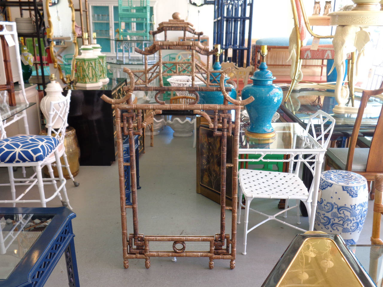 Faux Bamboo PAGODA Mirror in nice as found VINTAGE Condition. There are imperfections to the as found finish and a couple of old repairs to the wood frame.