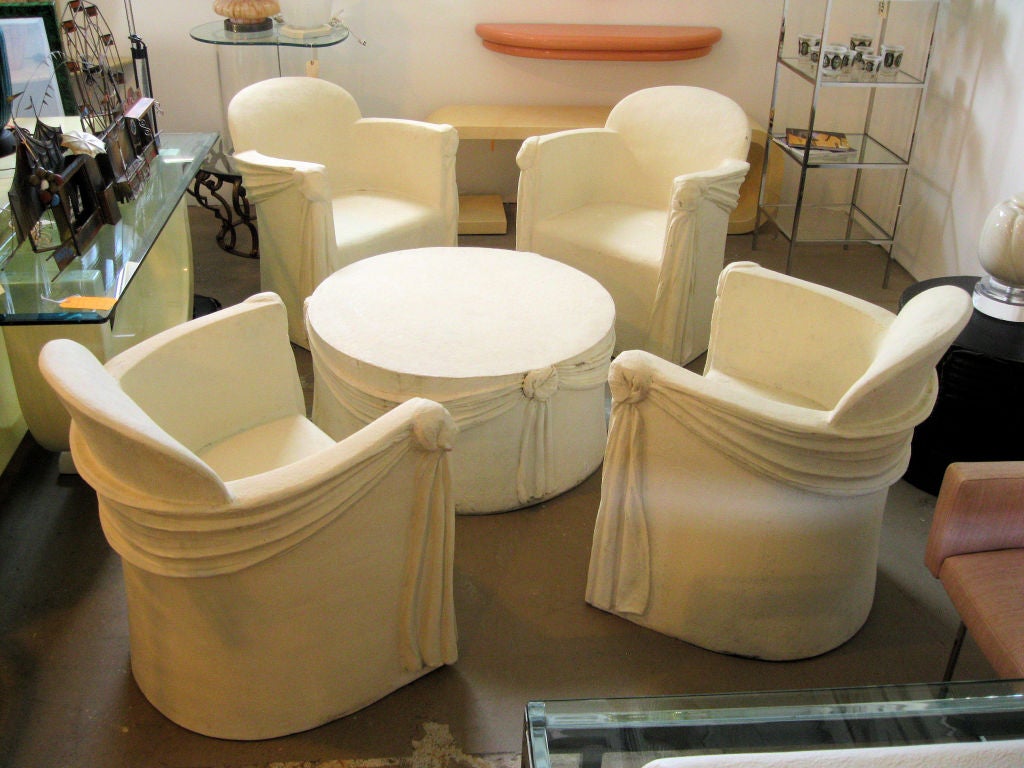 Draped Fiberglass Outdoor set with faux plaster finish.  The set includes 4 fiberglass chairs and a round coffee table that is made of a much heavier material.<br />
<br />
keywords:  Dickinson, Michael Taylor, Draper, molded fiberglass