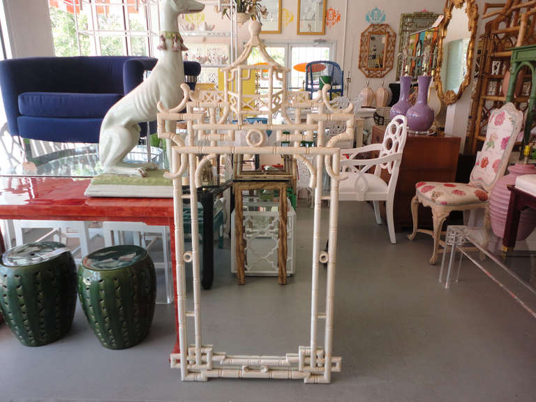 Faux bamboo pagoda mirror in nice as-found vintage condition. There are scuffs, scrapes and discoloration to the as found finish. Some old repairs.