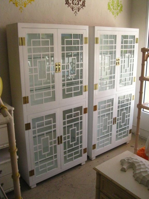Pair of Lacquered Fretwork Cabinets with interior glass shelves.<br />
<br />
keywords:  Palm Beach Regency, Hollywood Regency,  fretwork, vitrines, display cases