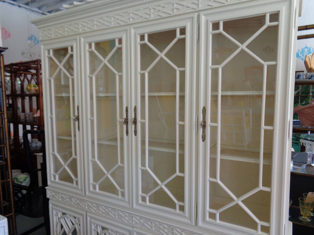 Fretwork Chippendale Pagoda Cabinet in good as found VINTAGE condition. There are minor scuffs and scrapes to the as found finish. 70s Regency