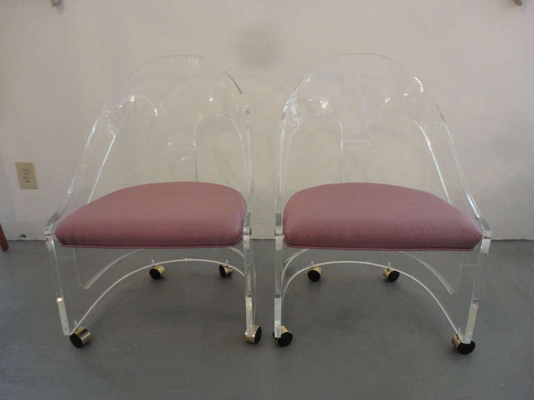 Pair of lucite spoon back chairs.  3 pairs available.