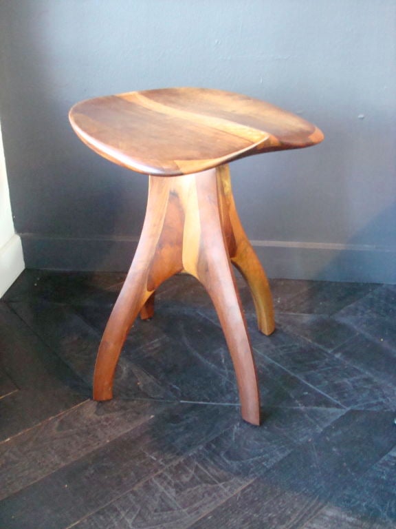 UNIQUELY CRAFTED,  VICTOR DINOVI SCULPTED A FUNCTION AND BEAUTIFUL SWIVEL PIANO STOOL OF IMBUIA WOOD.