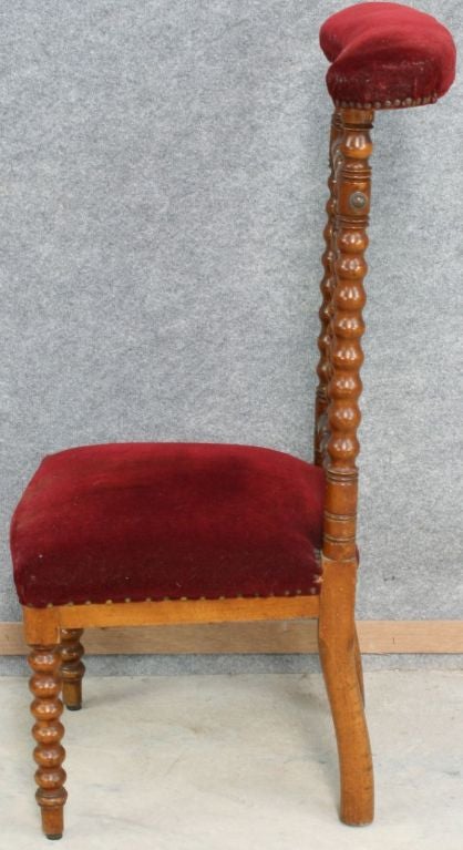 An Antique French Prie Dieu Prayer Chair Kneeler in mahogany and red velvet with unusual turned styling. A plaque recognizes the owner, Madame Y. De Leersnyder.