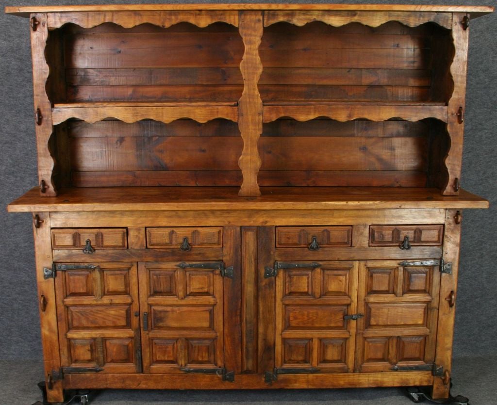 A rustic Spanish Mission Style Buffet Vasselier Sideboard Hutch in oak with interesting cast iron hardware