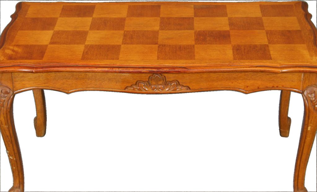 A nice French Country Louis XV Style Coffee Table from France dating to 1950 in oak with a pretty parquetry top.