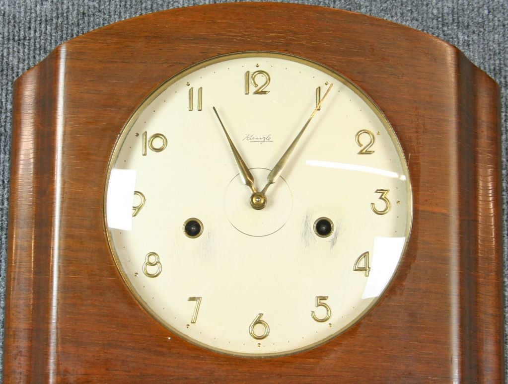 A German Regulator Wall Clock in the Art Deco style dating to 1930 with an unusual walnut case and marked with the stamp of Kienzle, one of the most famous German clock companies.