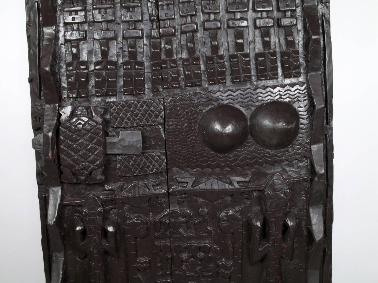 Hand-carved door from Mali, Africa. Carved in the style of the Dogon Tribe. Made from two planks from a huge tree, carved with many types of symbolism on the front.