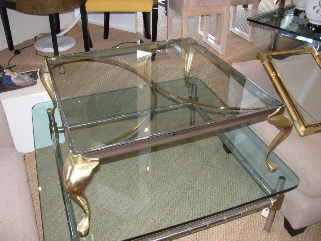 Hollywood Regency Elegant Two-Toned Brass Glass Coffee Table.
Fantastic chrome and polished brass coffee table.