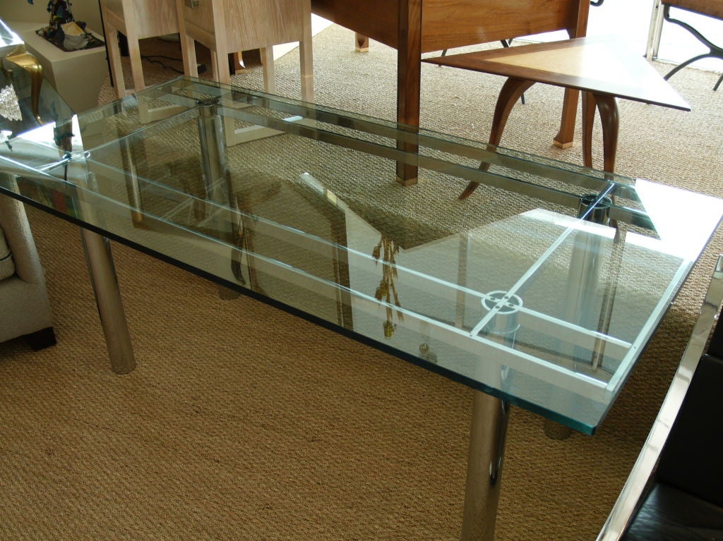 A mid century modern Andre coffee table designed by Tobia Scarpa for Knoll. Chrome frame and legs