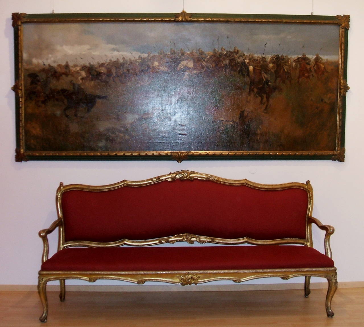 Pair of fine giltwood settees from 1750 with a light red fabric upholstery in original vintage condition. 
Made in Lucca, Tuscany.