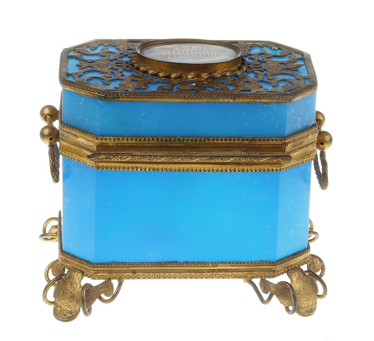 French Sevres Toilette box in translucent blue opaline. Rectangular with canted corners gilt ornaments and feet. Large escutcheon covering the front of the casket.