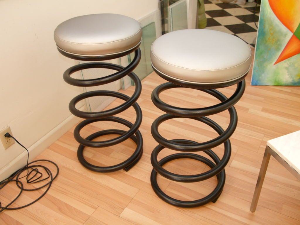 Solid iron bar stools done in a knoll fabric.