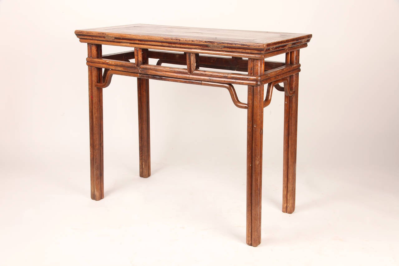 This 19th Century wine table is from China and made from Elm Wood. It features traditional mortise-and-tenon joinery and no nails were used.