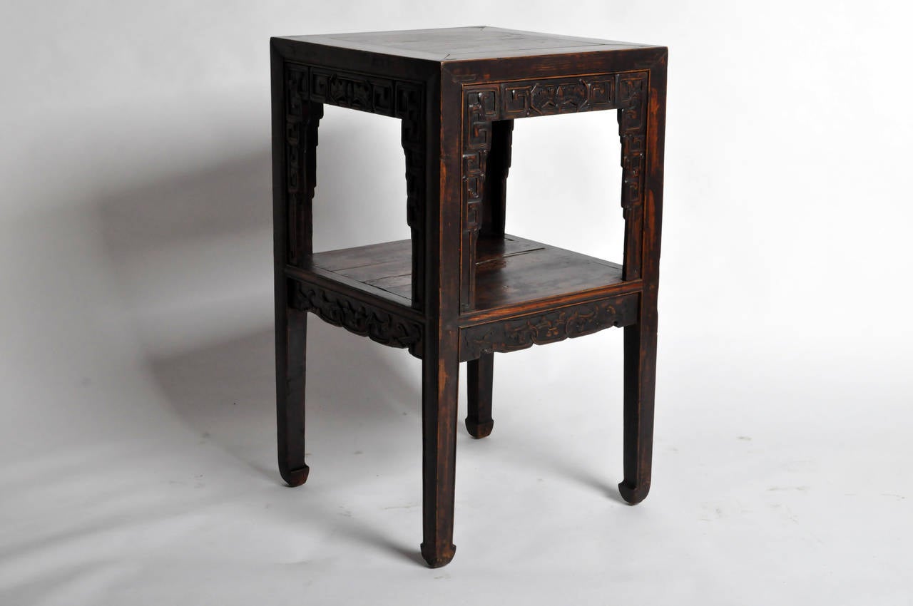 This gorgeous side table dates to the 19th Century and came from remote Shanxi Province, China. It is made from Elm Wood, features mortise-and-tenon joinery and still possesses its rich original patina. The slender legs terminate in a subtle horse