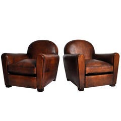 Pair of Round Back Leather Chairs