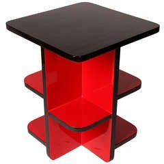 A Square Table with Red Shelves