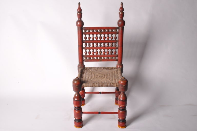 Colorful wooden chairs like this are indigenous to Pakistan’s Swat Valley. Swat Valley pieces often blend Eastern and Western motifs as the Swat Valley was an important link on the Silk Road.  This chair has been raised six inches to accommodate