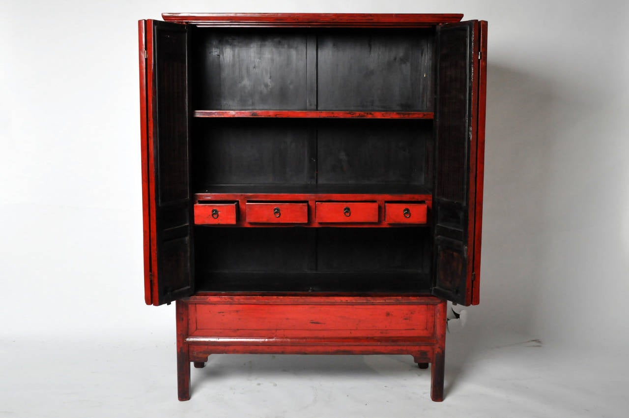 This graceful storage chest features gently tapered Ming style architecture and a lattice front. Fully restored and cleaned the vibrant red lacquer adds energy to modern monochrome design schemes. All interior drawers are function and in good