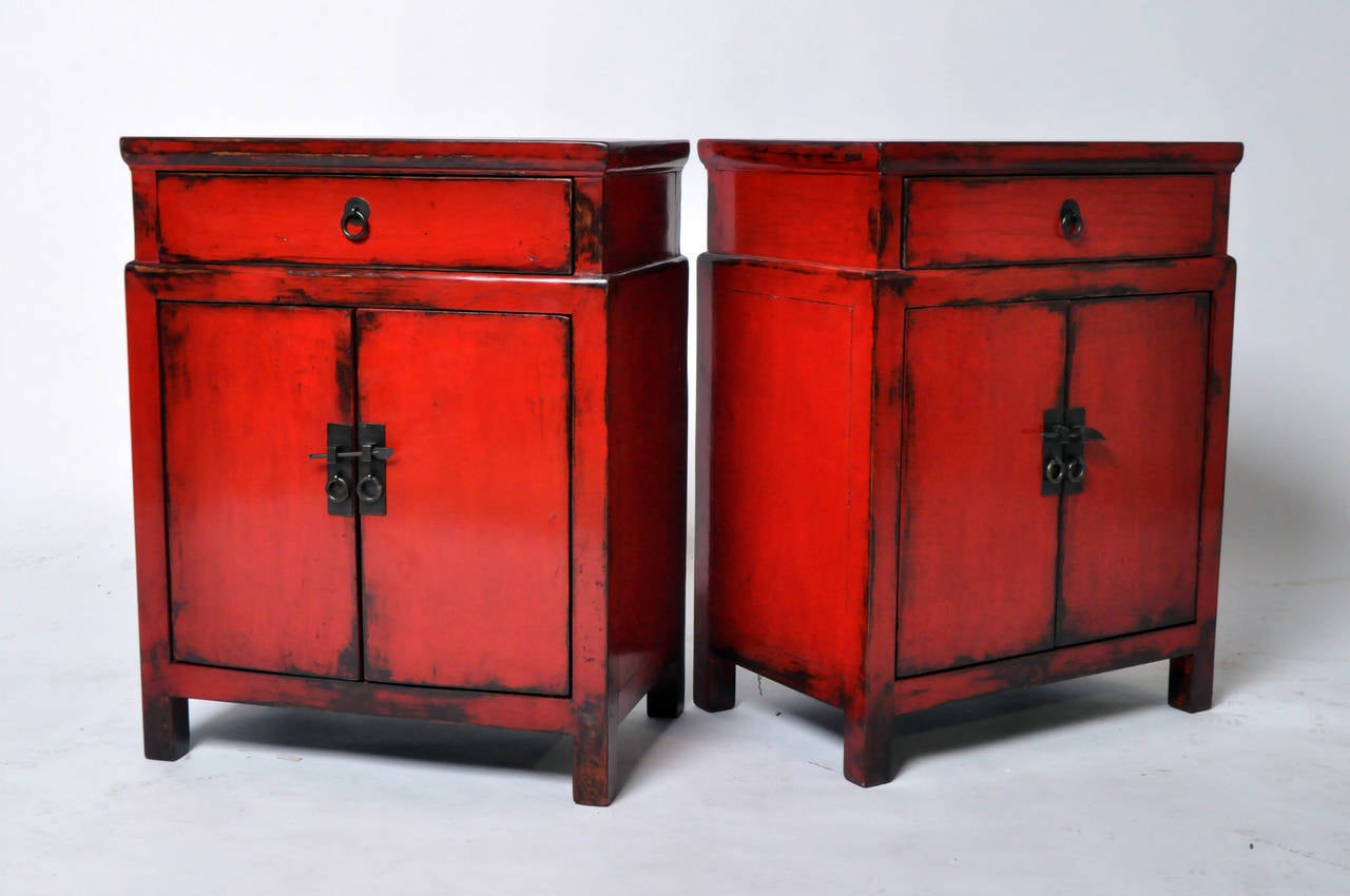 Pair of Chinese side chests are especially useful today as bed side chests. This pair was found near Shanghai. Color has been enhanced by a French-polish finish. Hardware, interior parts are new.