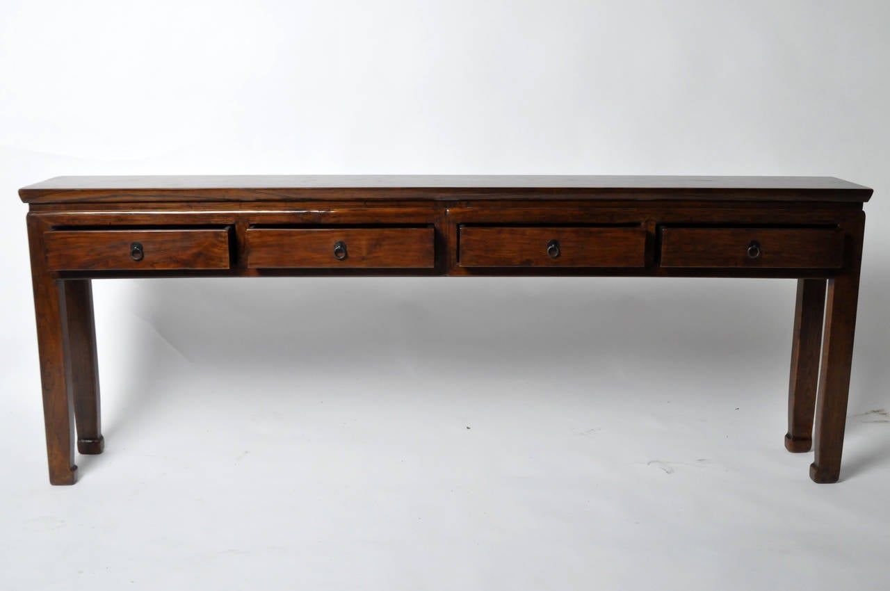 This 19th Century console table is from the province of Henan, China and made Elm Wood. It features 4 drawers, traditional mortise and tenon joinery and no nails were used. Professionally restored.