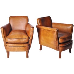 A pair of Leather Club Chairs