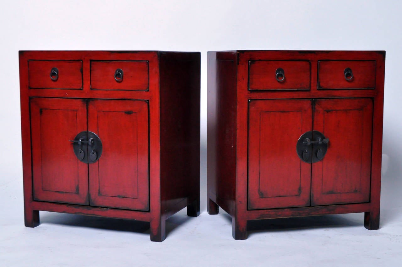 This Chinese bedside chests is from Zhejiang, China and features  traditional mortise and tenon joinery, ox-blood lacquer, and 2 drawers. Fully restored and functional.