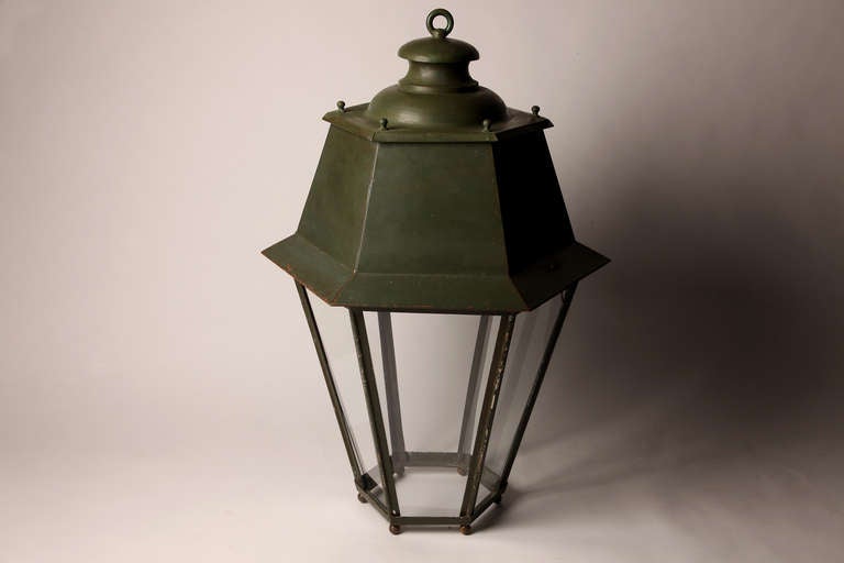 This large hexagonal gas lantern once illuminated the streets of Paris. Rewired for electricity, it adds a touch of Parisian glamour to any room in any city.