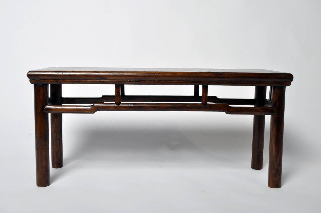 This lightweight but very sturdy bench has a solid wood top and round posted legs.
